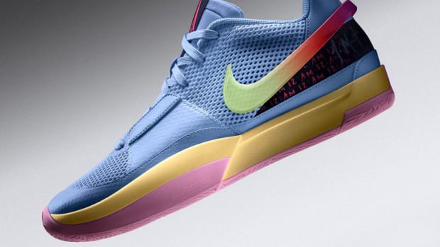 Side view of blue and gold Nike Ja shoe.